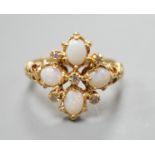 A 1970's 18ct gold, white opal and diamond chip set quatrefoil shaped ring, size O, gross weight 6.1