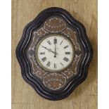A 19th century French wall clock, with mother of pearl decorative face, 62 cms high x 50 cms wide,
