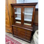 A Victorian mahogany chest with bookcase top, width 105cm depth 49cm height 173cm