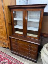 A Victorian mahogany chest with bookcase top, width 105cm depth 49cm height 173cm