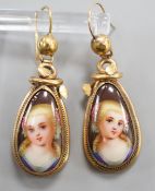 A pair of late Victorian pinchbeck and enamel drop earrings, each decorated with the bust of a lady,