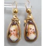 A pair of late Victorian pinchbeck and enamel drop earrings, each decorated with the bust of a lady,