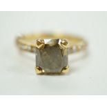 A modern 18ct gold and single stone cut cornered rectangular modified brilliant cut fancy dark