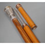 A silver handled cane win a horn tip and a copper handled flask cane,silver handled cane 94 cms