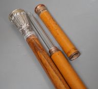 A silver handled cane win a horn tip and a copper handled flask cane,silver handled cane 94 cms