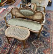 An early 20th century French caned beech four piece salon suite, settee length 130cm, height 86cm