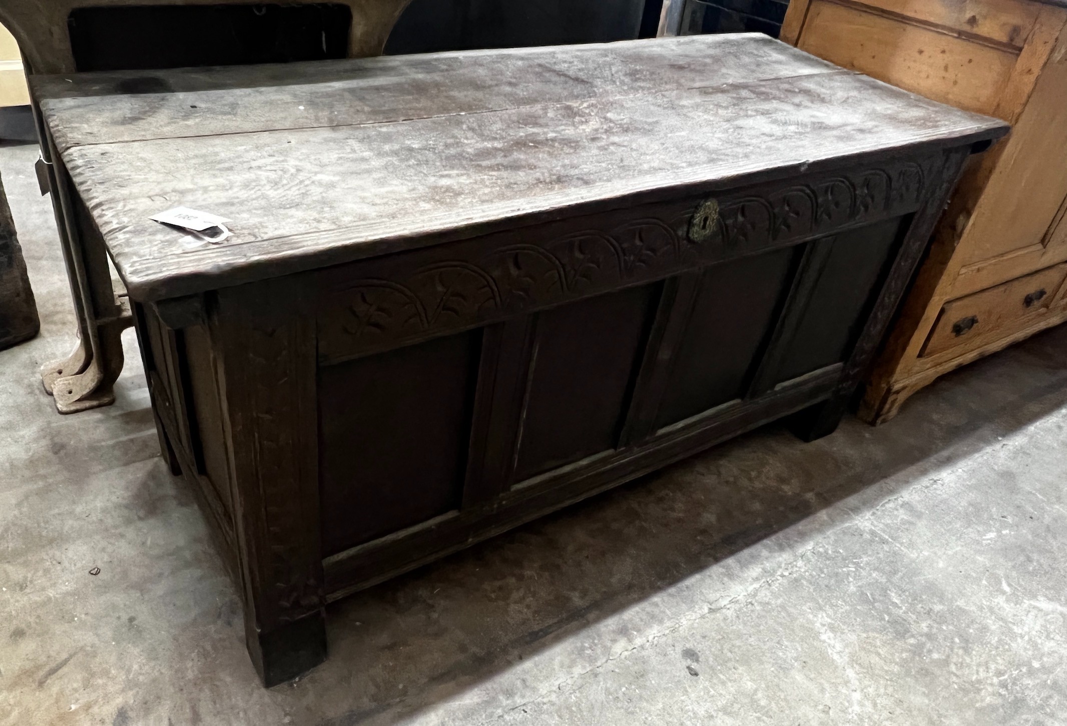 An 18th century panelled oak coffer, width 129cm depth 53cm height 63cm