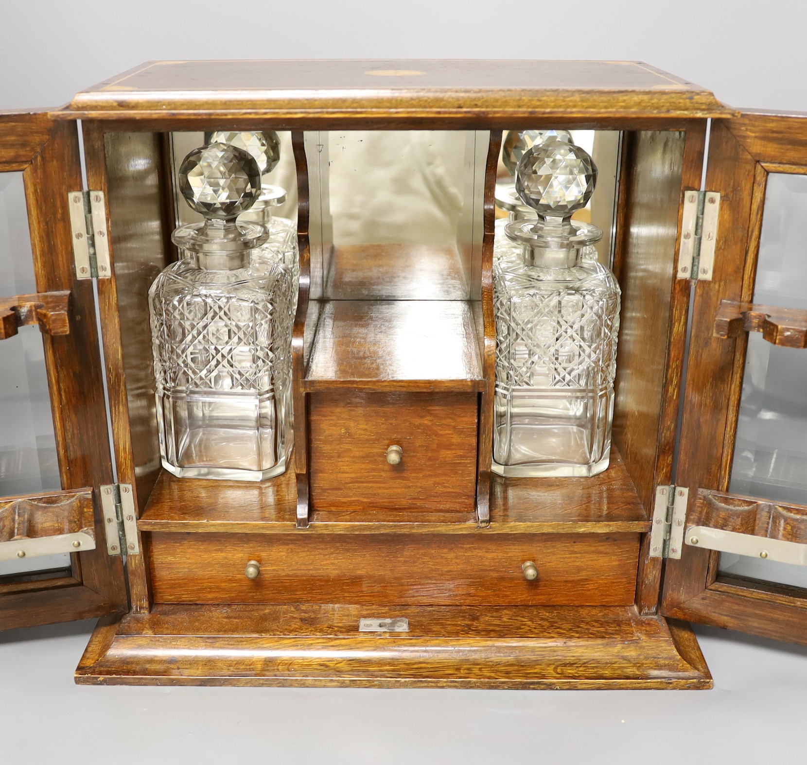 An Edwardian inlaid oak drinks cabinet, with two cut glass decanters, 40 cms wide x 37 cms high, - Bild 2 aus 2