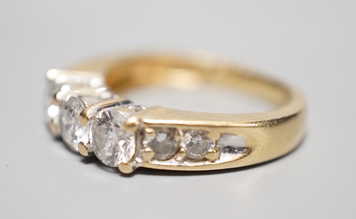 A 14k yellow metal and three stone diamond ring, with four stone diamond set shoulders, size K, - Image 2 of 5