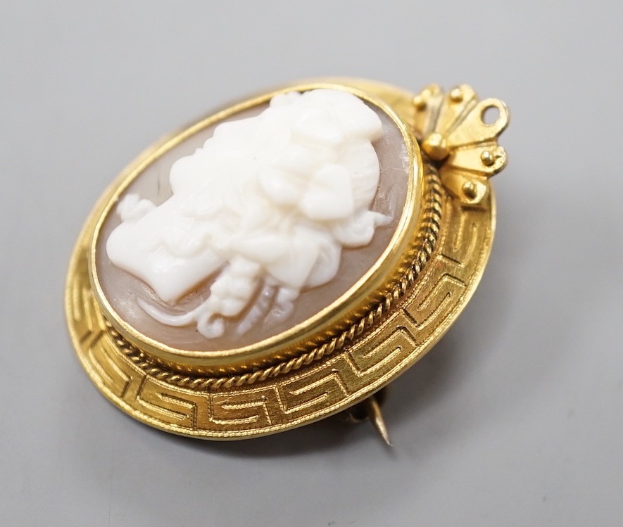 A yellow metal mounted cameo shell brooch, carved with the bust of a lady to dexter, 28mm. - Image 3 of 4