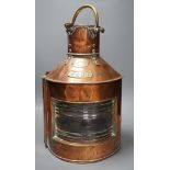 A copper ship’s port lamp, manufactured by Telford.Grier & Mackay, Glasgow, 1918,42 cms high,