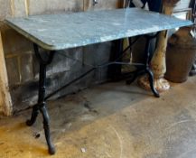 A rectangular cast iron and reconstituted marble garden table, length 120cm, height 60cm