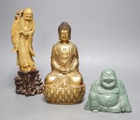 A Chinese greenstone Buddha, a soapstone carving of Shou Lao on carved hardwood stand, and a
