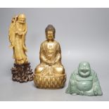 A Chinese greenstone Buddha, a soapstone carving of Shou Lao on carved hardwood stand, and a