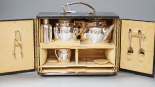 Christopher Dresser for Hukin and Heath, a silver plated travelling picnic / teaset, in suede