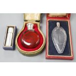 A cased Sampson Mordan white metal mounted ruby glass scent bottle, 7cm, one other mounted glass