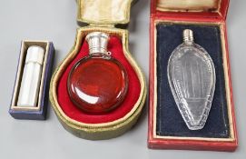 A cased Sampson Mordan white metal mounted ruby glass scent bottle, 7cm, one other mounted glass