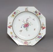 An 18th century Chinese export crested octagonal plate with floral decoration, 21.5cm wide