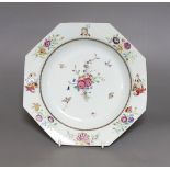 An 18th century Chinese export crested octagonal plate with floral decoration, 21.5cm wide