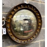 A Regency giltwood convex wall mirror in need of repair, diameter 56cm