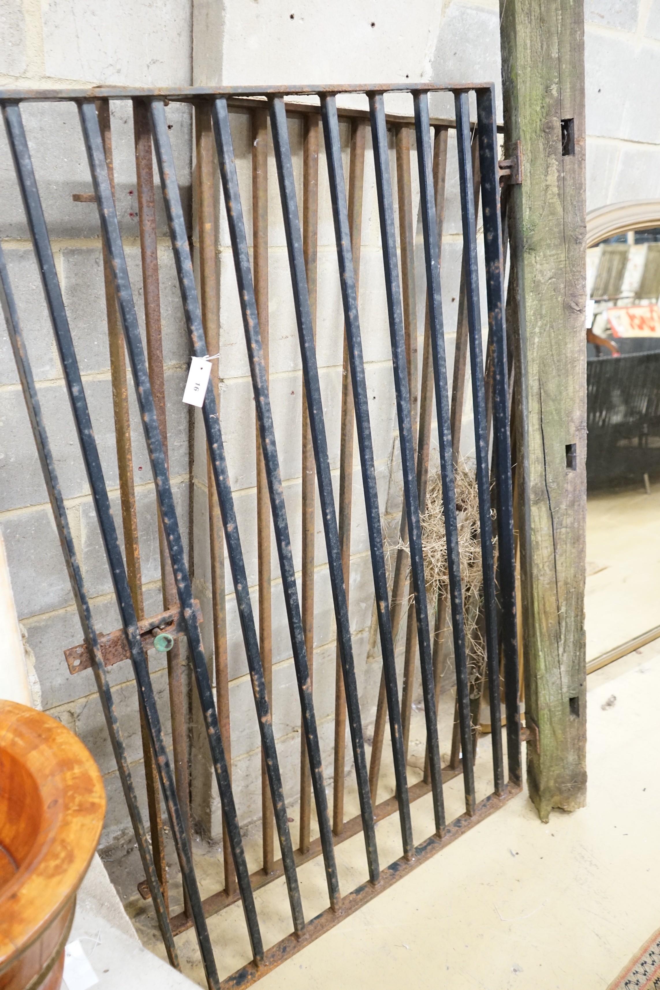 A pair of small wrought iron gates, each width 93cm, height 160cm