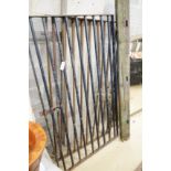 A pair of small wrought iron gates, each width 93cm, height 160cm