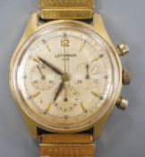 A gentleman's mid 20th century Lemania 105 steel and gold plated chronograph wrist watch, on