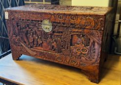 A Chinese carved camphorwood trunk, length 100cm, depth 50cm, height 60cm