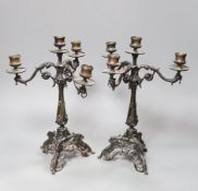 A pair of Victorian style bronze three branch candelabra, 32cm
