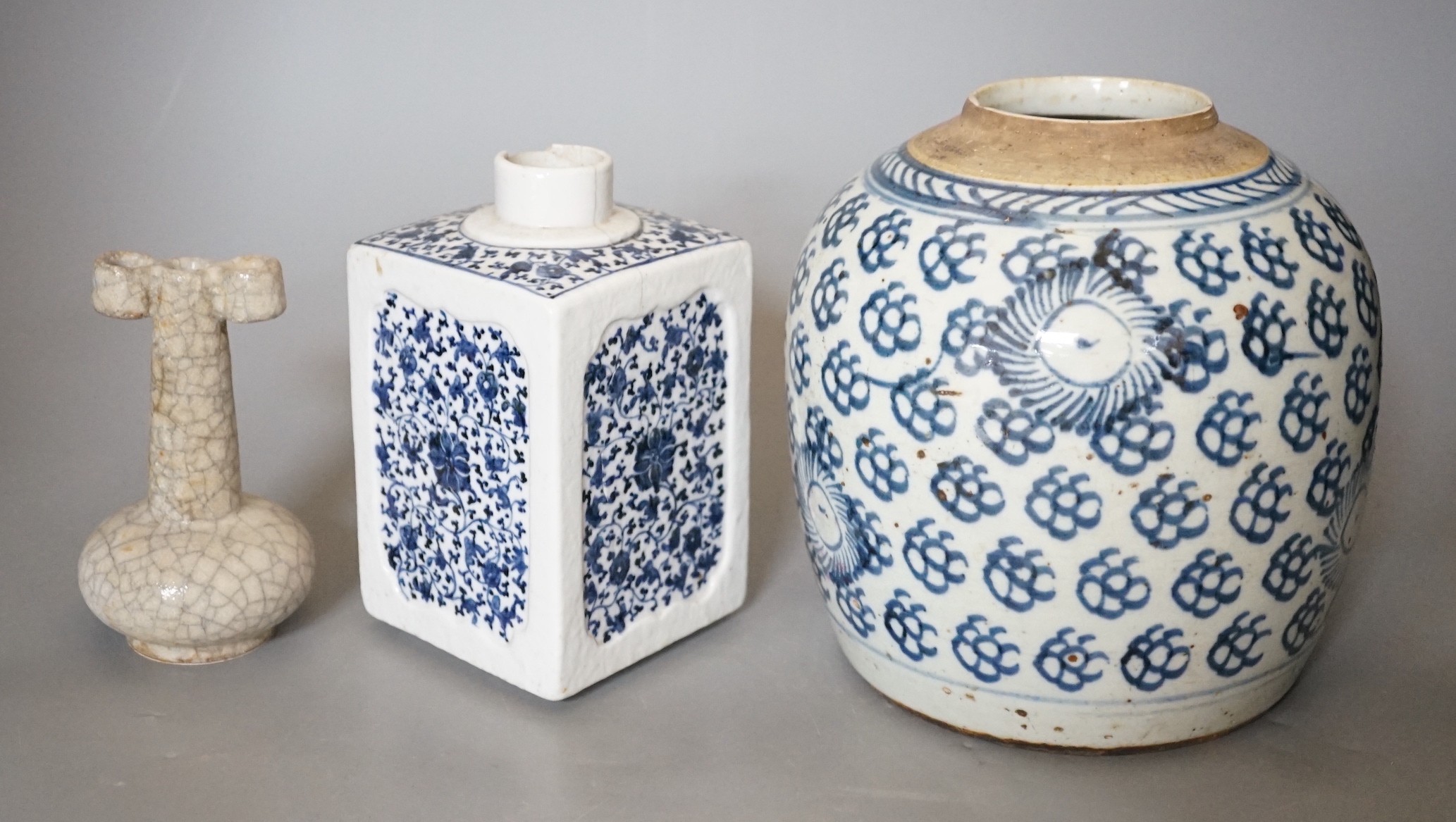 An 18th century Chinese provincial jar together with a tea canister and crackleglaze vase, tallest