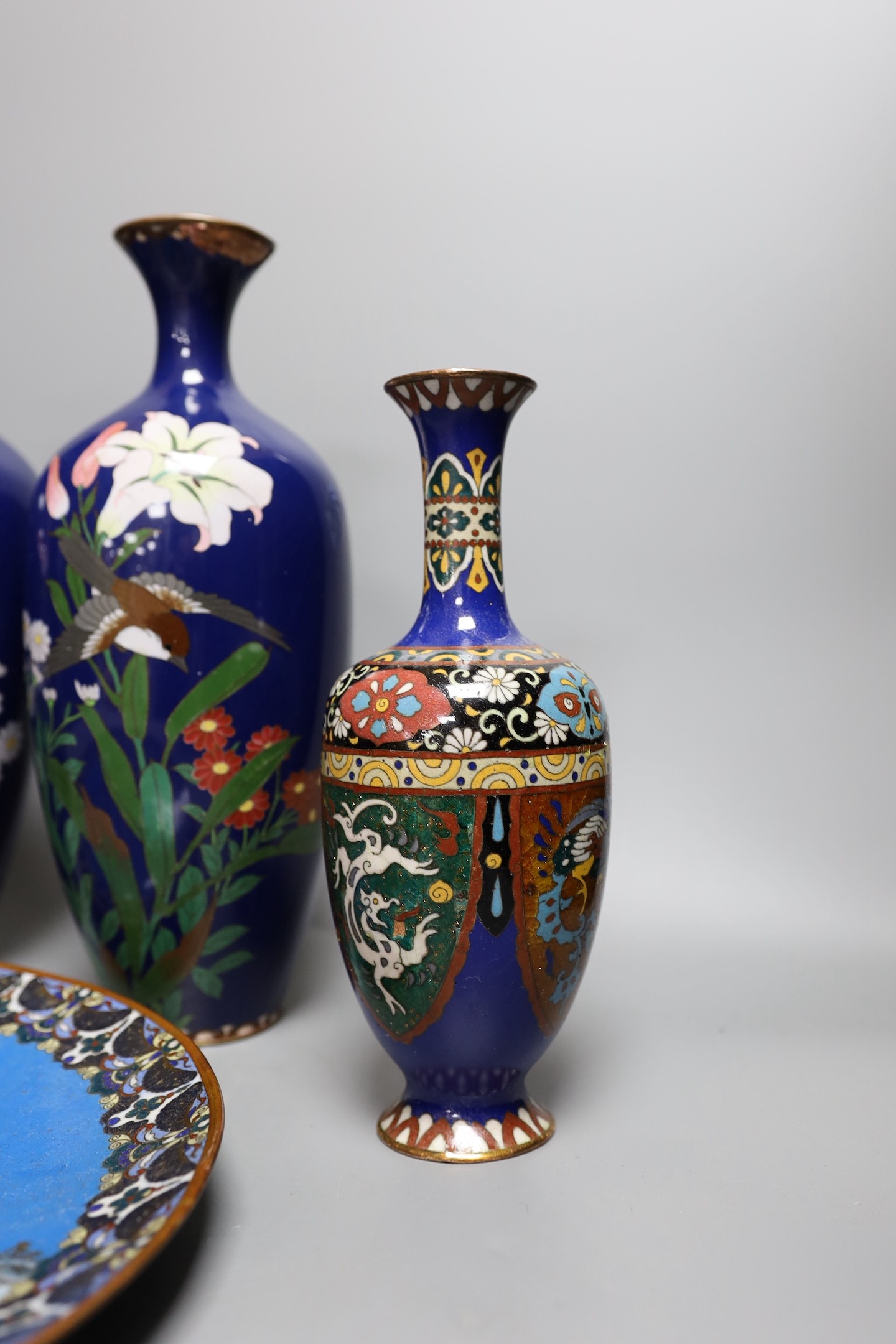 A group of Japanese cloisonné enamel wares to include a pair of vases, two other vases and a dish, - Image 5 of 7