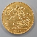 An Edward VII 1903 gold sovereign.