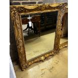 A Victorian giltwood and composition rectangular wall mirror converted from a picture frame, width