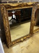 A Victorian giltwood and composition rectangular wall mirror converted from a picture frame, width