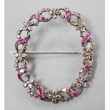 A 19th century white metal rose cut diamond and ruby set open work oval wreath brooch, 44mm.