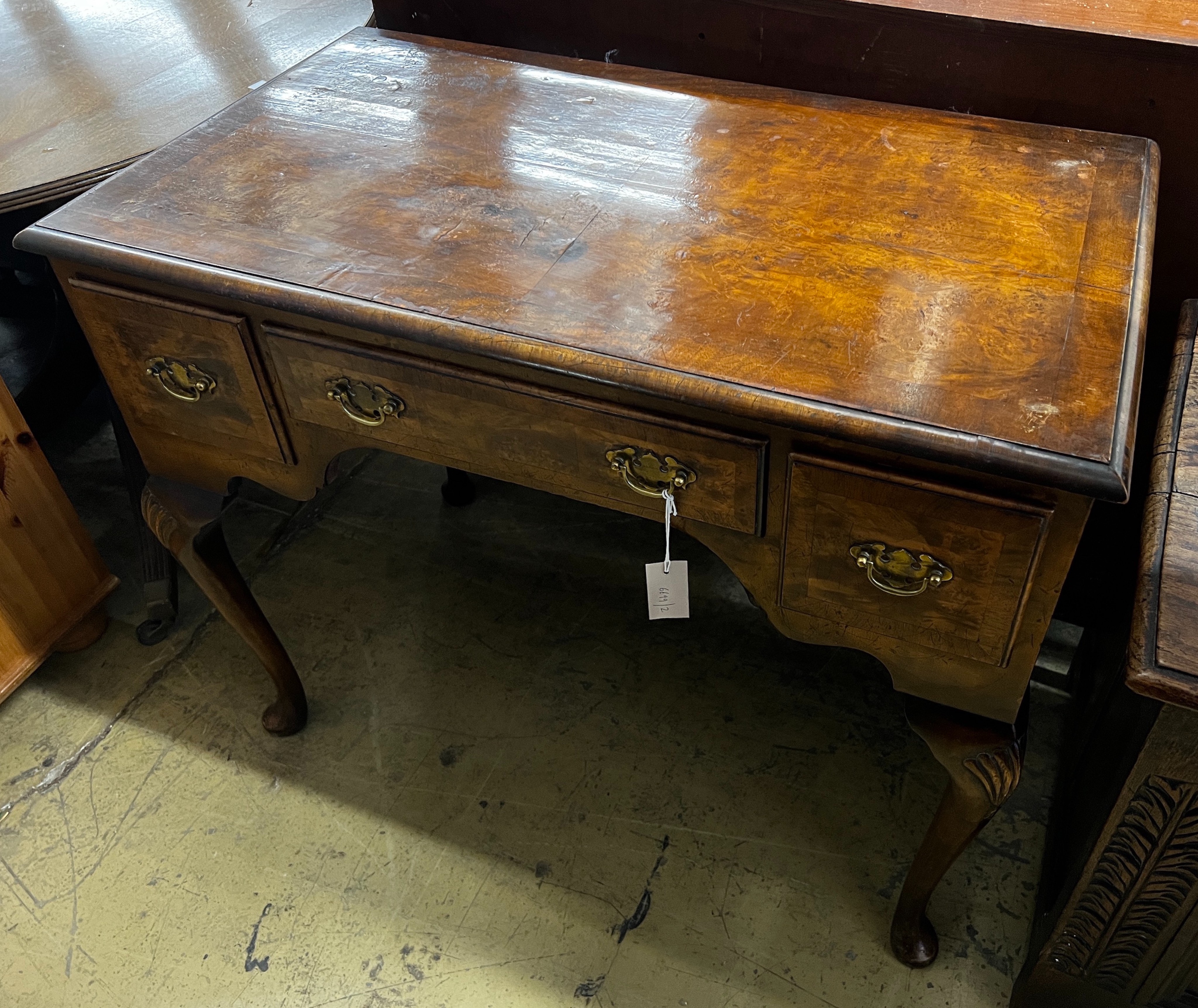 A Queen Anne revival walnut kneehole table, length 92cm, depth 53cm, height 76cm