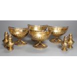 A set of four 20th century Spanish gilt white metal boat shaped pedestal bowls, with pierced