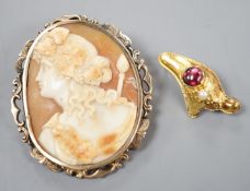 A yellow metal, garnet and seed pearl set brooch, 30mm gross 1.7 grams and a yellow metal mounted