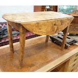 A 19th century provincial elm drop flap kitchen table, length 117cm, width 57cm, height 69cm