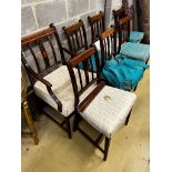 A set of seven George III inlaid mahogany dining chairs, one with arms