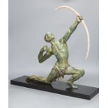 A large Art Deco bronzed figure of an archer, on black marble stand,55 cms wide,