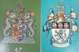 Four tin and enamel armorial signs,largest 38 cms x 36 cms,