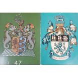 Four tin and enamel armorial signs,largest 38 cms x 36 cms,