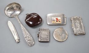 Four assorted early 20th century silver vesta cases, including a silver gilt mounted nut, and patent