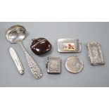 Four assorted early 20th century silver vesta cases, including a silver gilt mounted nut, and patent