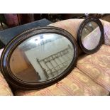 An Edwardian oval simulated tortoiseshell mirror and one other mirror, larger width 90cm, height