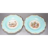 A pair of English porcelain plates with moulded white and turquoise borders both painted with
