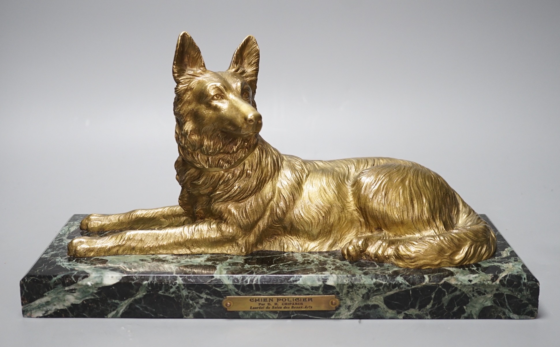 After D H Chiparus, a gilt metal figure of a German Shepherd dog, on marble base,36 cms wide,