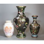 Two Chinese cloisonné enamel vases, and a porcelain ‘lion dog’ vase, tallest 33cm