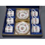 A Coalport floral coffee set, boxed,